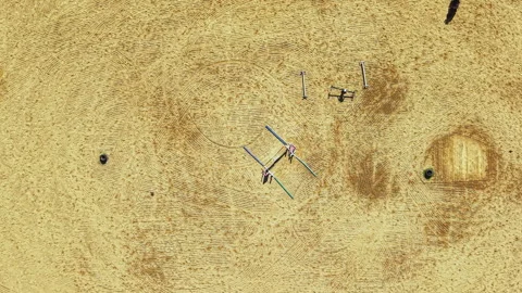 Construction work on a large open site with machinery and workers visible at Stock Footage 340871298