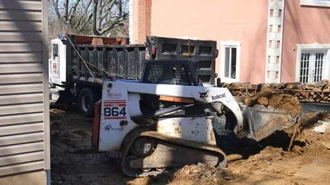 Construction work - loader dumps dirt into dump truck 4K Stock-Footage 97607877
