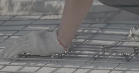 Construction work, man knitting reinforcement, metal structure Stock Footage 305641163