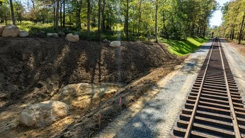 Construction Work Near Train Tracks in a Forest Area With Large Stones Stock Photos