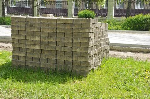 Construction work on paving slabs. Laying new paving stones on a city sidewal Stock Photos