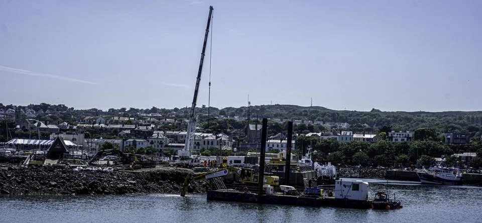 Construction work on a pier extension in Howth Harbour, Dublin, Ireland. new Stock Photos