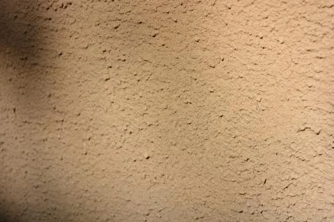 Construction work, plastering load-bearing street walls in sunlight. Stock Photos