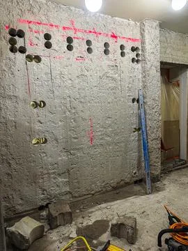 Construction work in progress on building site involving concrete modificat.. Stockfoto's