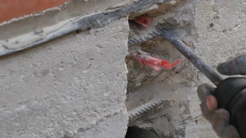 Construction work. Puncher making holes in concrete. Stock Footage 141383217