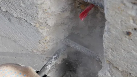 Construction work. Puncher making holes in concrete. Stock Footage 141383661
