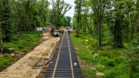 Construction Work on Railway Tracks Through a Wooded Area in Daylight Hours 스톡 사진