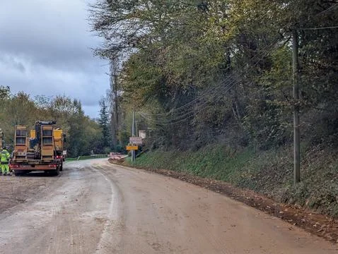 Construction work on rural road through scenic Dordogne landscape France Photos