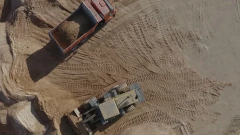 Construction work, sand, trucks picking up sand, sunny weather Stock Footage 300870476
