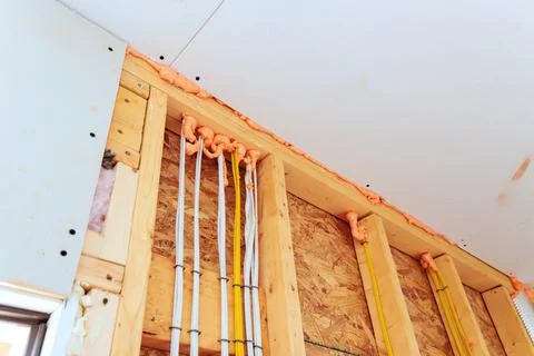 Construction work shows electrical wires fire fighting insulation in buildi.. Stock Photos