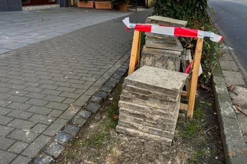 Construction work on sidewalk blocks at urban location Stock Photos