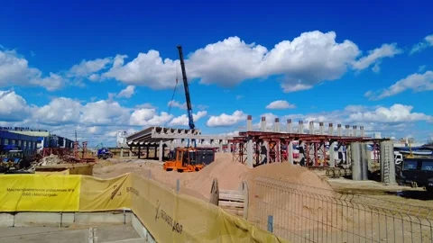 Construction work at a site with cranes and equipment taking place in a city env Video stock 338326153