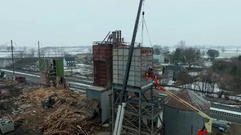 Construction Work at a Site During Winter With Cranes and Workers in a Rura.. Stock Footage 345052216