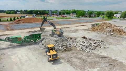 Construction Work at a Site With Heavy Machinery Moving Materials and Dirt Stock Footage 341436182
