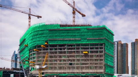 Construction work site of a new skyscraper and traditional bamboo scaffolding. Stock Footage 56453294