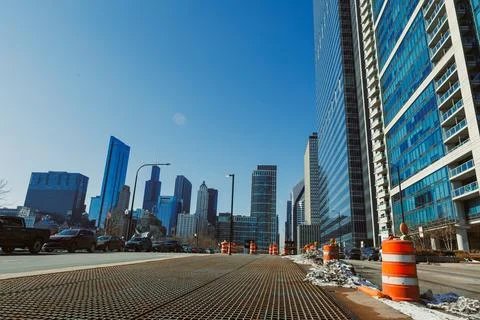 Construction work is taking place on a city street in downtown Chicago whil.. Stock Photos
