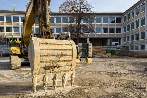Construction work is taking place at a school in the afternoon Stock Photos