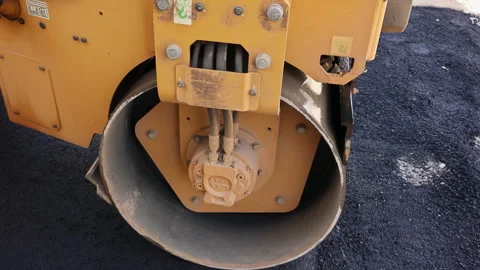 Construction work is taking place as steamroller compacts asphalt on road Stock Footage 342949496