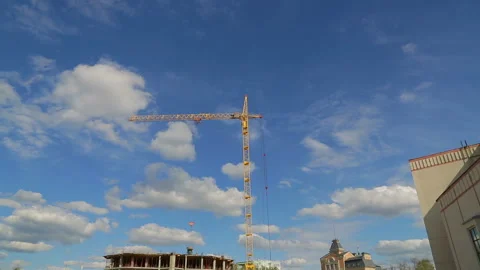 Construction work on the tower crane on the construction of the building with Видео 107785675