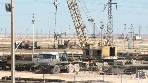 Construction work is underway at an oil field in the desert. Stock Footage 149263130