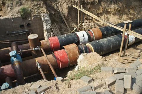 Construction work. Workers. Pipe laying. Repair of communications. Stock Photos