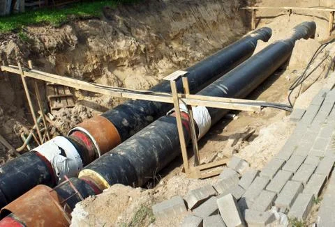 Construction work. Workers. Pipe laying. Repair of communications. Stock Photos