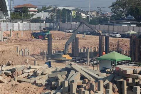 Construction work zones of piling where piles are driven into the ground. Stock Photos
