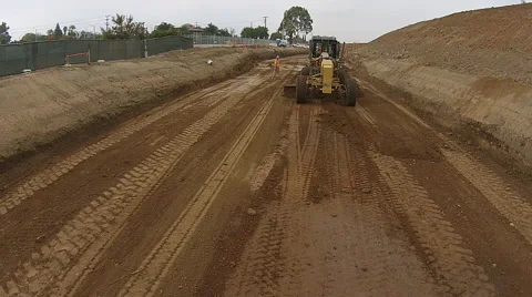 Construction Worker and Grader (Fly over) Video stock 43348909