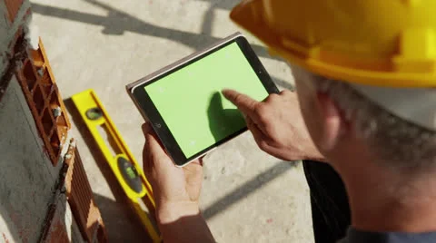 Construction worker and new house, man using digital tablet pc Video stock 25456248