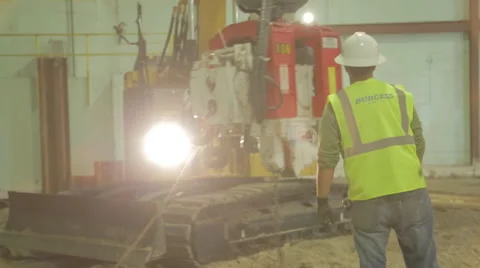 Construction Worker And Yellow Excavator On Construction Site Stock Footage 46590150