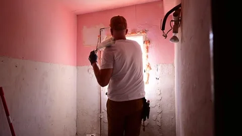 Construction worker applying polyurethane foam for window installation 스톡 동영상 346167889