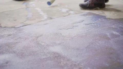 Construction worker applying waterproofing sealant on concrete floor Stock Footage 304128182