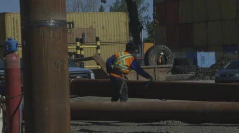 Construction worker attaching a foundation pile Stock Footage 65052279