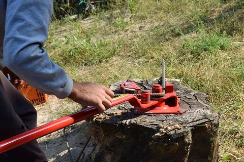 A construction worker bends a steel bar into a concrete structure Stock Photos