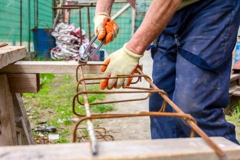 Construction worker binding rebar for reinforce concrete column Stock Photos