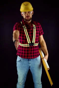 Construction Worker  on black background press the flesh. Stock Photos