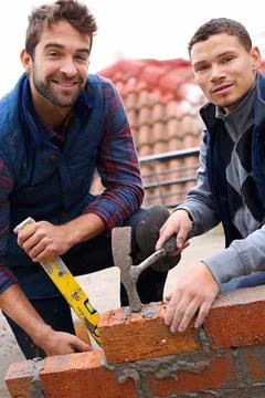 Construction worker, bricklayer and men with tools for building a brick wall 스톡 사진