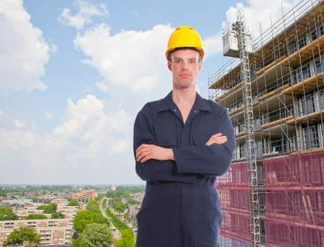 Construction worker with building and view over city Stock Photos
