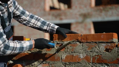 Construction Worker Building a Brick House Video stock 297305004
