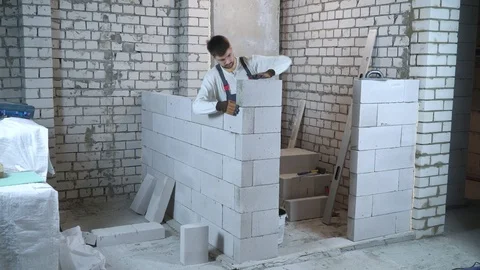 Construction worker building interior wall Stock Footage 102558553