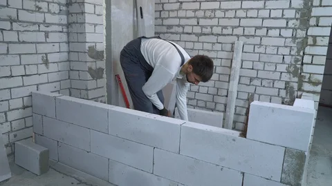 Construction worker building interior wall Stock Footage 102908088