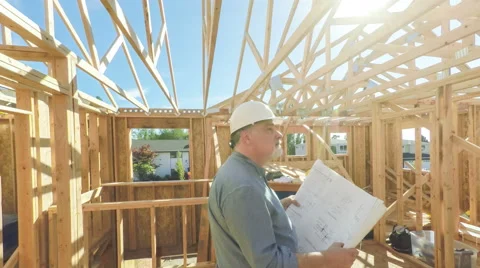 Construction worker with building plans Stock Footage