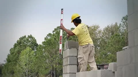 A Construction Worker Builds a Masonry Wall Video stock 21111762
