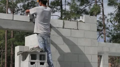A Construction Worker Builds a Masonry Wall Video stock 21111950