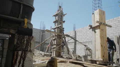 Construction worker in is busy at the unfinished building. Stock Footage 232083268