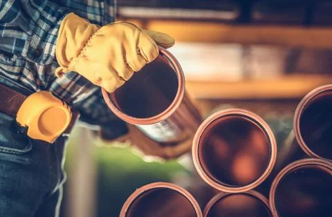 Construction Worker Buying Sanitary Plastic Pipes. Industrial Theme. Foto stock