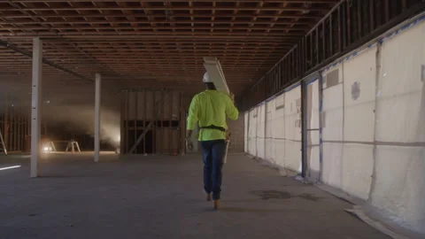 Construction Worker Carries Boards Stock Footage 270389956