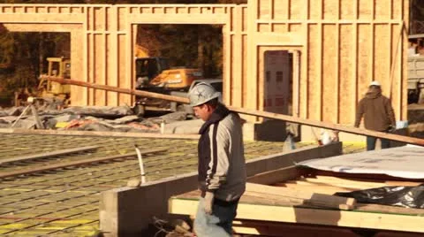 Construction worker carries lumber Stock Footage 21558945
