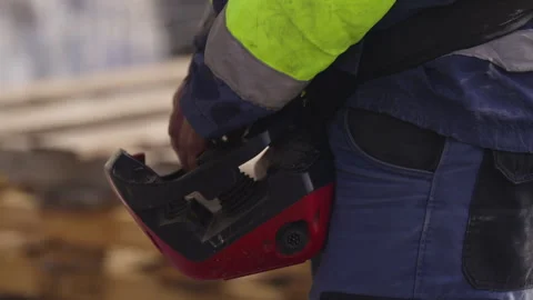 Construction Worker Carrying Remote Control Unit for Crane Operation Stock Footage 336098334