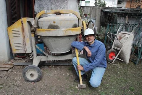 Construction worker with cement mixer Stock Photos